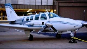 twin engine airplane white with blue and silver stripes350 197